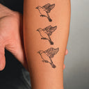 Swallow Transformation by Tyler Hobbs - tattoo render on arm 